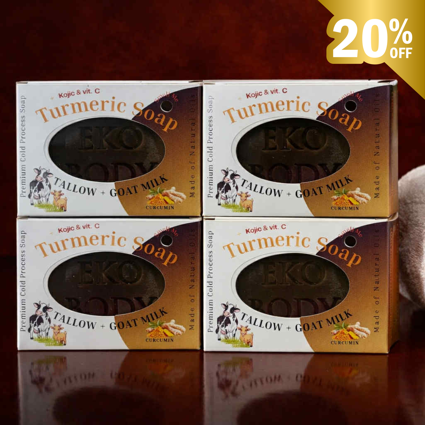 Four boxes of Turmeric Soap with visible branding on a reflective surface.